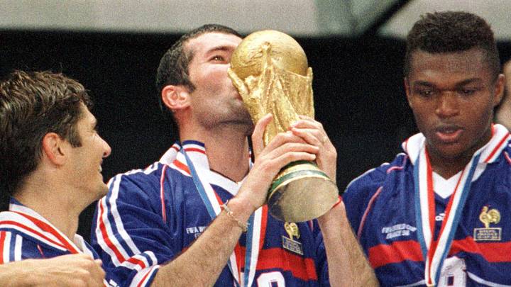 Soccer World Cup Final 1998: France wins World Cup - Zidane kisses the trophy Soccer World Cup Final 1998: France wins World Cup - Zidane kisses the trophy