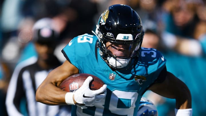 Jacksonville Jaguars wide receiver Jamal Agnew (39) scrambles down the sideline while being defended