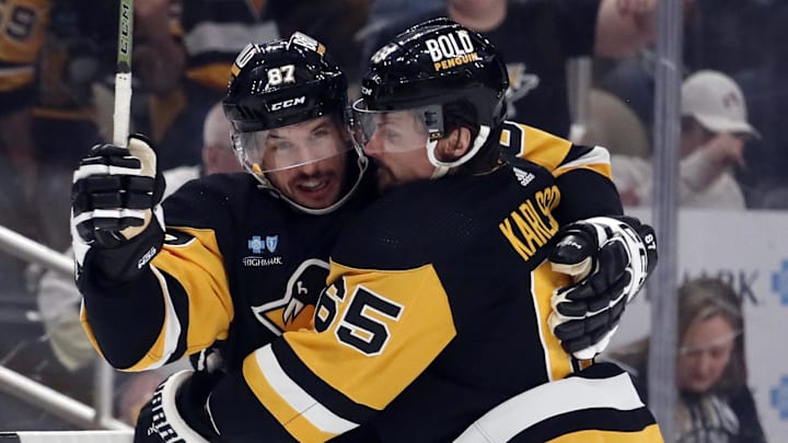 Apr 15, 2024; Pittsburgh, Pennsylvania, USA; Pittsburgh Penguins center Sidney Crosby (87) and defenseman Erik Karlsson (65) celebrate a goal by Karlsson against the Nashville Predators during the first period at PPG Paints Arena. The Penguins won 4-2. Mandatory Credit: Charles LeClaire-Imagn Images Apr 15, 2024; Pittsburgh, Pennsylvania, USA; Pittsburgh Penguins center Sidney Crosby (87) and defenseman Erik Karlsson (65) celebrate a goal by Karlsson against the Nashville Predators during the first period at PPG Paints Arena. The Penguins won 4-2. Mandatory Credit: Charles LeClaire-Imagn Images