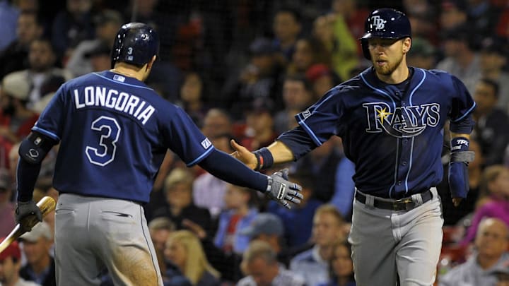Sep 23, 2014; Boston, MA, USA; Tampa Bay Rays third baseman Evan Longoria (3) congratulates second baseman Ben Zobrist (18) after scoring a run during the eighth inning against the Boston Red Sox at Fenway Park. Mandatory Credit: Bob DeChiara-Imagn Images