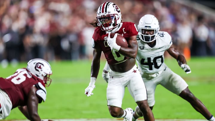 Sep 21, 2024; Columbia, South Carolina, USA; South Carolina Gamecocks running back Juju McDowell (0) rushes against the Akron Zips in the second quarter at Williams-Brice Stadium. Mandatory Credit: Jeff Blake-Imagn Images