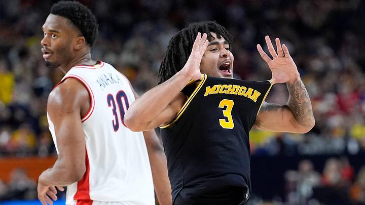 Michigan guard Elliot Cadeau (3) celebrates a play in the second half of their Final Four game against Arizona at Lucas Oil Stadium in Indianapolis on Saturday, April 4, 2026.
