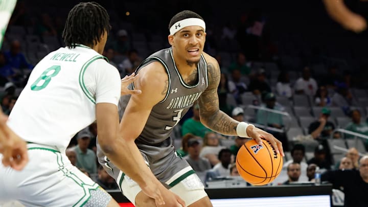Mar 15, 2025; Fort Worth, TX, USA;  UAB Blazers forward Yaxel Lendeborg (3) controls the ball as North Texas Mean Green forward Grant Newell (8) defends during the first half at Dickies Arena. Mandatory Credit: Chris Jones-Imagn Images