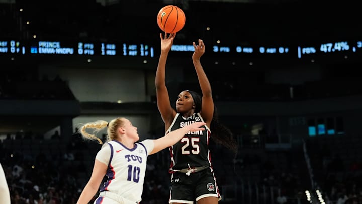 Dec 8, 2024; Fort Worth, Texas, USA;  South Carolina Gamecocks guard Raven Johnson (25) scores a basket over TCU Horned Frogs guard Hailey Van Lith (10) during the first half at Dickies Arena. Mandatory Credit: Chris Jones-Imagn Images