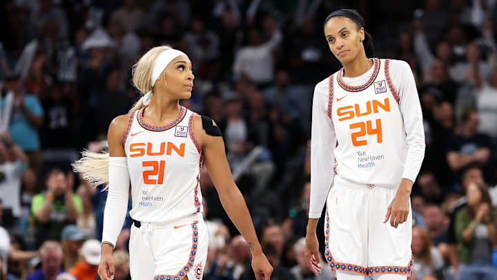 Oct 8, 2024; Minneapolis, Minnesota, USA; Connecticut Sun guard DiJonai Carrington (21) and forward DeWanna Bonner (24) look on during the second half of game five of the 2024 WNBA playoffs against the Minnesota Lynx at Target Center. Mandatory Credit: Matt Krohn-Imagn Images