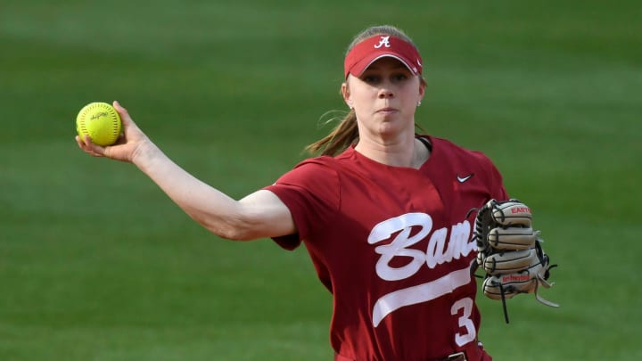 Feb 21, 2024; Northport, Alabama, USA; Alabama shortstop Kenleigh Cahalan makes a throw to first to