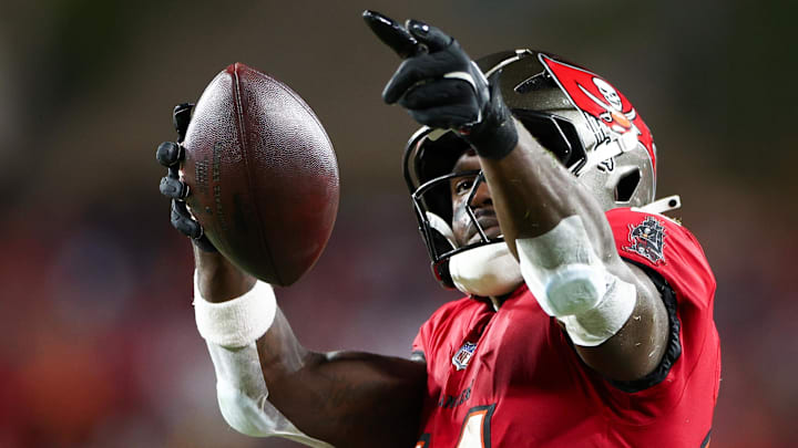 Oct 21, 2024; Tampa, Florida, USA; Tampa Bay Buccaneers wide receiver Chris Godwin (14) celebrates a first down against the Baltimore Ravens in the second quarter at Raymond James Stadium. 