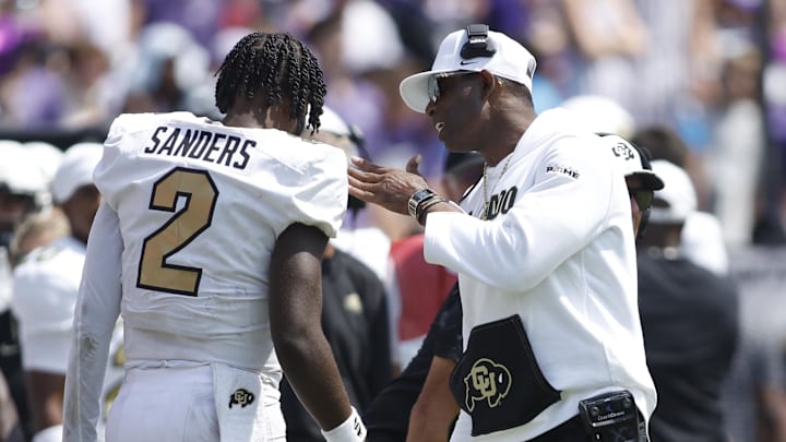 Sep 2, 2023; Fort Worth, Texas, USA; Colorado Buffaloes head coach Deon Sanders talks to quarterback