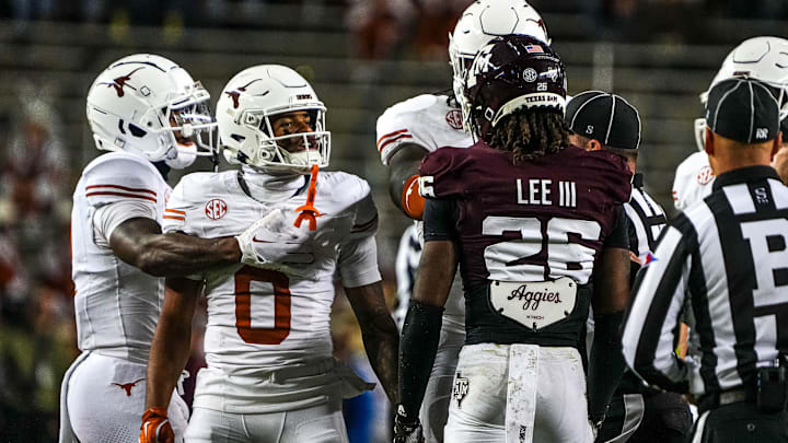 Texas Longhorns receiver DeAndre Moore Jr. (0) gets into a verbal argument with Texas A&M defensive back Will Lee III (26) during the Lone Star Showdown at Kyle Field on Saturday, Nov. 30, 2024 in College Station, Texas.