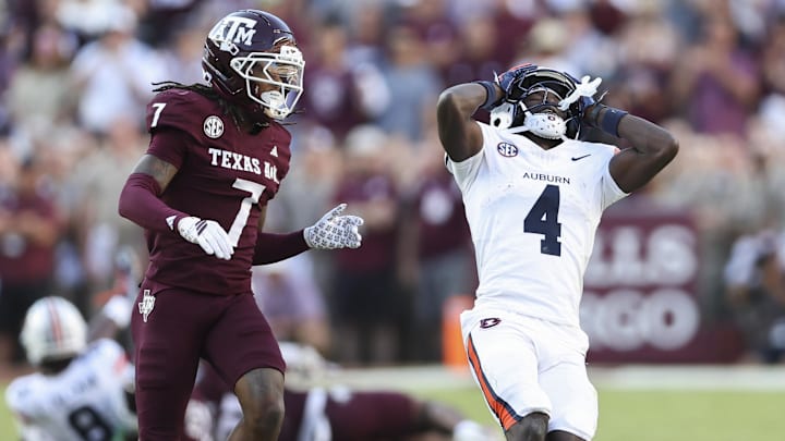 Sep 27, 2025; College Station, Texas, USA; Auburn Tigers wide receiver Malcolm Simmons (4) reacts as Texas A&M Aggies cornerback Tyreek Chappell (7) defends during the fourth quarter at Kyle Field. Mandatory Credit: Troy Taormina-Imagn Images