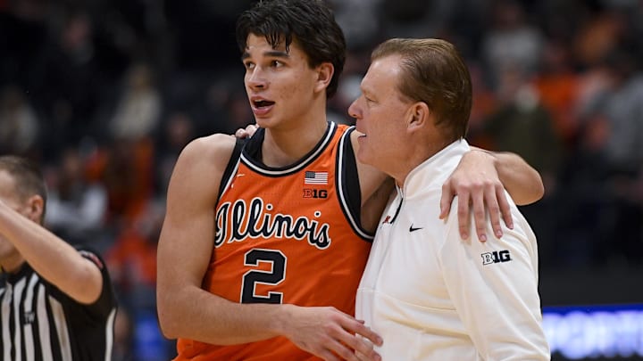 Dec 6, 2025; Nashville, Tennessee, USA;  Illinois Fighting Illini guard Andrej Stojakovic (2) celebrates the win with head coach Brad Underwood against the Tennessee Volunteers during the second half at Bridgestone Arena. Mandatory Credit: Steve Roberts-Imagn Images