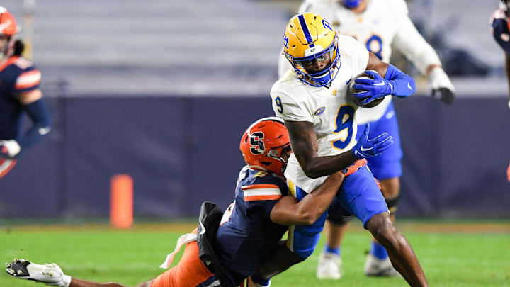 Nov 11, 2023; New York, New York, USA;  Syracuse Orange defensive back Jason Simmons Jr. (6) makes a tackle on Pittsburgh Panthers wide receiver Konata Mumpfield (9) during the second half at Yankee Stadium. Mandatory Credit: Dennis Schneidler-Imagn Images