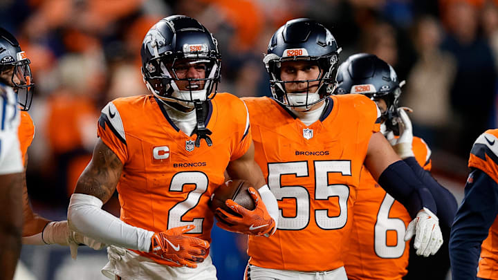 Denver Broncos cornerback Pat Surtain II (2) reacts with linebacker Cody Barton (55) after an interception in the fourth quarter against the Indianapolis Colts at Empower Field at Mile High. 