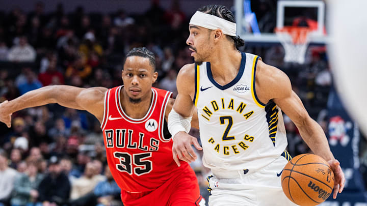 Jan 28, 2026; Indianapolis, Indiana, USA;  Indiana Pacers guard/forward Andrew Nembhard (2) dribbles the ball while Chicago Bulls forward/guard Isaac Okoro (35) defends in the second half at Gainbridge Fieldhouse. Mandatory Credit: Trevor Ruszkowski-Imagn Images