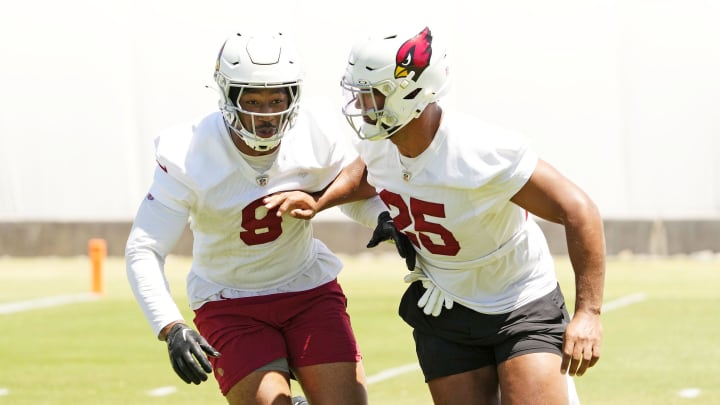 Arizona Cardinals linebackers BJ Ojulari (9) and Zaven Collins (25) during organized team activities at the Dignity Health Arizona Cardinals Training Center in Tempe on June 3, 2024.