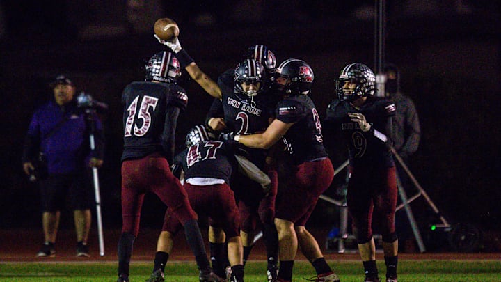 Red Mountain Mountain Lions celebrates after Red Mountain Mountain Lions Andrew Bonham (2) intercepts a pass to the end zone in the second half of the Red Mountain High School vs. Queen Creek High School 6A semifinals game Friday, November 22, 2019 at Westbrook High School in Mesa. (Nicole Neri/The Republic)

Cent02 783ix503j525eov8frw Original