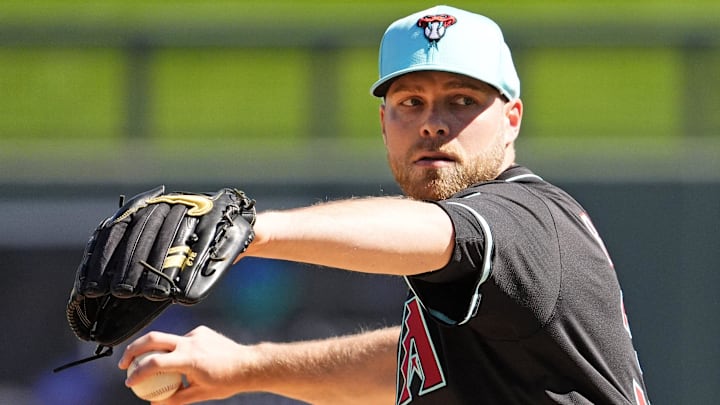 Arizona Diamondbacks pitcher Corbin Burnes warms up before facing the Milwaukee Brewers in the first inning of a spring training game on Feb. 26, 2025, in Scottsdale at Salt River Fields at Talking Stick.