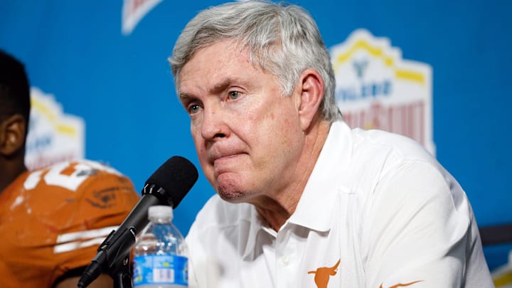 Dec 30, 2013; San Antonio, TX, USA; Texas Longhorns head coach Mack Brown reacts during the post game press conference after a game against the Oregon Ducks at Alamo Dome. Oregon defeated Texas 30-7. Mandatory Credit: Soobum Im-Imagn Images