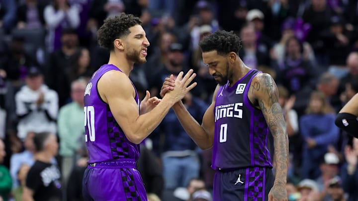 Dec 3, 2024; Sacramento, California, USA; Sacramento Kings guard Malik Monk (0) is congratulated by guard Colby Jones (20) during the fourth quarter against the Houston Rockets at Golden 1 Center. Mandatory Credit: Sergio Estrada-Imagn Images Dec 3, 2024; Sacramento, California, USA; Sacramento Kings guard Malik Monk (0) is congratulated by guard Colby Jones (20) during the fourth quarter against the Houston Rockets at Golden 1 Center. Mandatory Credit: Sergio Estrada-Imagn Images