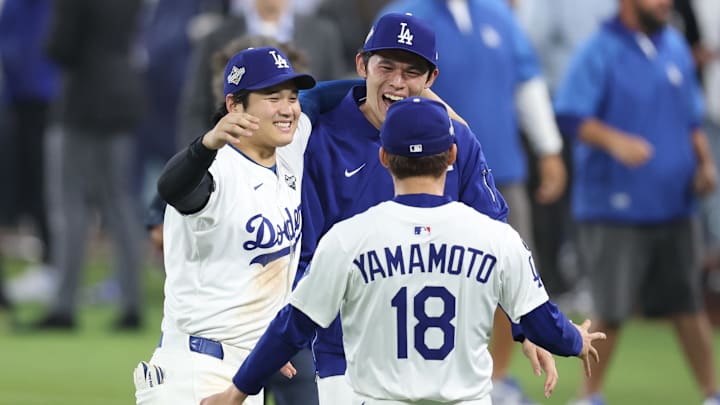 Oct 27, 2025; Los Angeles, California, USA; Los Angeles Dodgers designated hitter Shohei Ohtani (17) celebrates with pitcher Roki Sasaki (11) and pitcher Yoshinobu Yamamoto (18) after winning in the eighteenth inning against the Toronto Blue Jays in game three of the 2025 MLB World Series at Dodger Stadium. Mandatory Credit: Kiyoshi Mio-Imagn Images Oct 27, 2025; Los Angeles, California, USA; Los Angeles Dodgers designated hitter Shohei Ohtani (17) celebrates with pitcher Roki Sasaki (11) and pitcher Yoshinobu Yamamoto (18) after winning in the eighteenth inning against the Toronto Blue Jays in game three of the 2025 MLB World Series at Dodger Stadium. Mandatory Credit: Kiyoshi Mio-Imagn Images