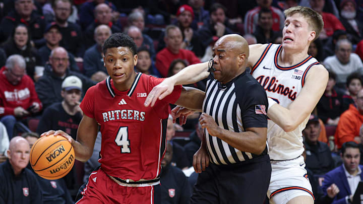 Feb 5, 2025; Piscataway, New Jersey, USA; Rutgers Scarlet Knights guard Ace Bailey (4) goes to the basket in front of Illinois Fighting Illini forward Ben Humrichous (3) and a referee during the second half at Jersey Mike's Arena. Mandatory Credit: Vincent Carchietta-Imagn Images Feb 5, 2025; Piscataway, New Jersey, USA; Rutgers Scarlet Knights guard Ace Bailey (4) goes to the basket in front of Illinois Fighting Illini forward Ben Humrichous (3) and a referee during the second half at Jersey Mike's Arena. Mandatory Credit: Vincent Carchietta-Imagn Images