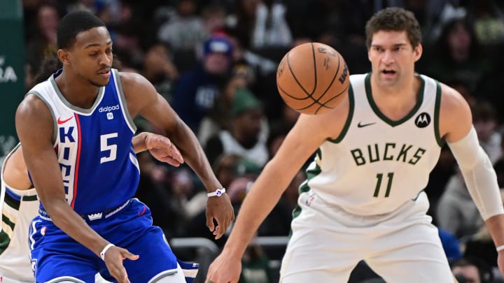 Jan 14, 2024; Milwaukee, Wisconsin, USA; Sacramento Kings guard De'Aaron Fox (5) passes the ball away from Milwaukee Bucks center Brook Lopez (11) in the first quarter at Fiserv Forum. Mandatory Credit: Benny Sieu-USA TODAY Sports Jan 14, 2024; Milwaukee, Wisconsin, USA; Sacramento Kings guard De'Aaron Fox (5) passes the ball away from Milwaukee Bucks center Brook Lopez (11) in the first quarter at Fiserv Forum. Mandatory Credit: Benny Sieu-USA TODAY Sports
