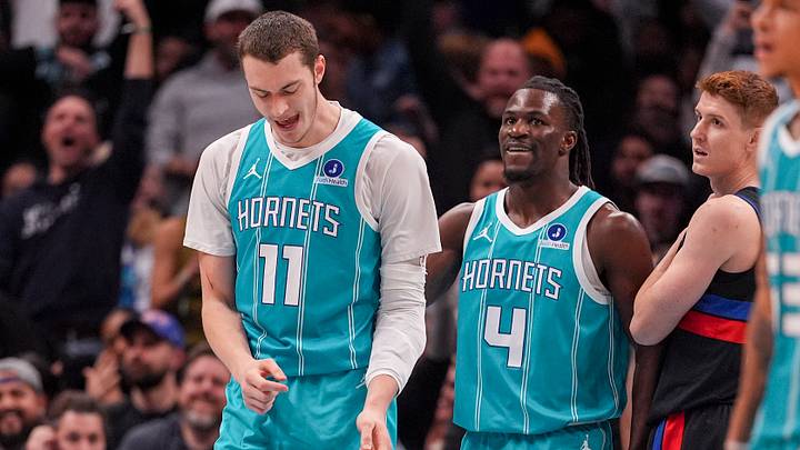 Feb 9, 2026; Charlotte, North Carolina, USA; Charlotte Hornets center Ryan Kalkbrenner (11) celebrates his dunk with guard Sion James (4) during the second half against the Detroit Pistons at Spectrum Center. Mandatory Credit: Jim Dedmon-Imagn Images Feb 9, 2026; Charlotte, North Carolina, USA; Charlotte Hornets center Ryan Kalkbrenner (11) celebrates his dunk with guard Sion James (4) during the second half against the Detroit Pistons at Spectrum Center. Mandatory Credit: Jim Dedmon-Imagn Images