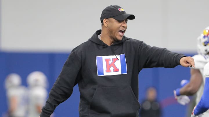 Kansas co-defensive coordinator and cornerbacks coach D.K. McDonald works with players during a team practice Tuesday, April 2, 2024, inside the Indoor Football Practice Facility.