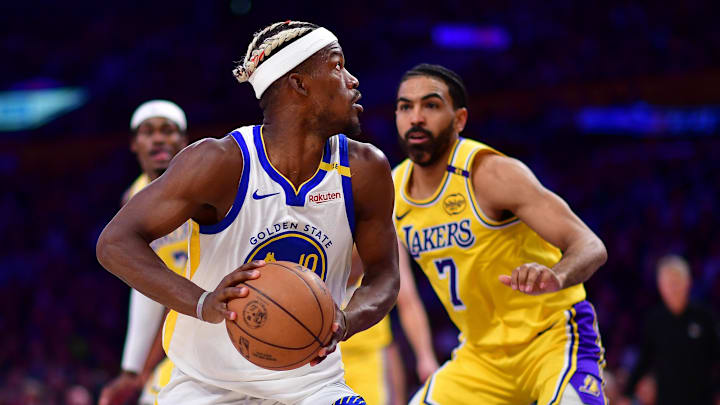 Apr 3, 2025; Los Angeles, California, USA; Golden State Warriors forward Jimmy Butler III (10) controls the ball against Los Angeles Lakers guard Gabe Vincent (7) during the second half at Crypto.com Arena. Mandatory Credit: Gary A. Vasquez-Imagn Images