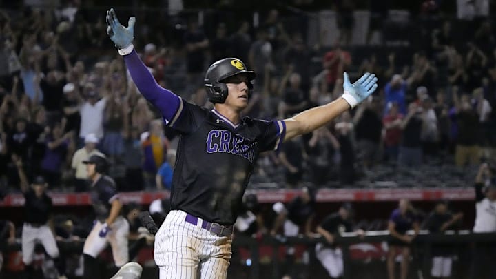 Queen Creek's Tait Reynolds (4) celebrates his game-winning hit beating Sandra Day O'Connor 7-6 in 10 innings to win the 6A state baseball final at Tempe Diablo Stadium on May 14, 2024.
