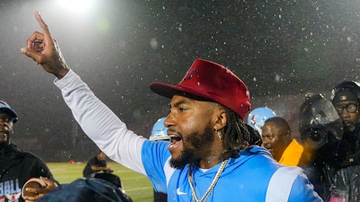 Delaware State head coach DeSean Jackson celebrates his first win as a college head coach after the Hornets' 37-32 win against Albany at Alumni Stadium in Dover on Sept. 6, 2025. Two weather delays stretched the game past seven hours.