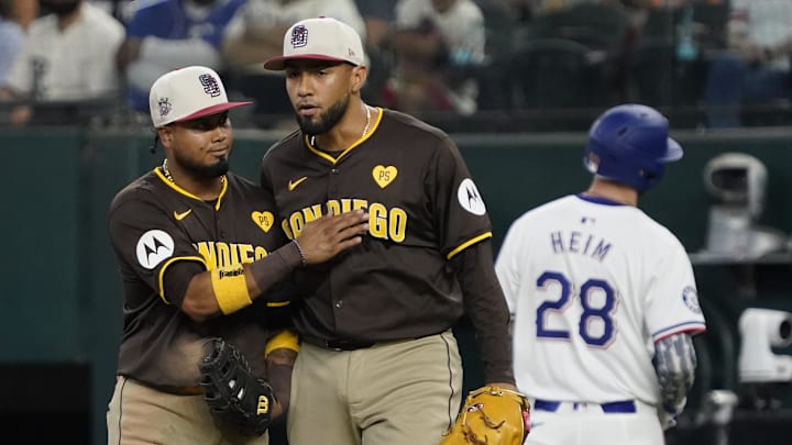 Jul 4, 2024; Arlington, Texas, USA; San Diego Padres second baseman Luis Arraez (4) and pitcher Robert Suarez (75) after recording the final out against the Texas Rangers at Globe Life Field. Mandatory Credit: Raymond Carlin III-Imagn Images