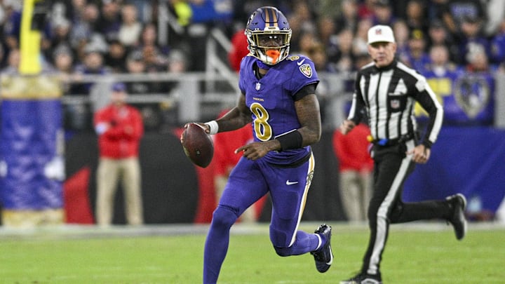 Nov 7, 2024; Baltimore, Maryland, USA; Baltimore Ravens quarterback Lamar Jackson (8) looks to pass on the run during the first quarter  against the Cincinnati Bengals at M&T Bank Stadium. Mandatory Credit: Tommy Gilligan-Imagn Images