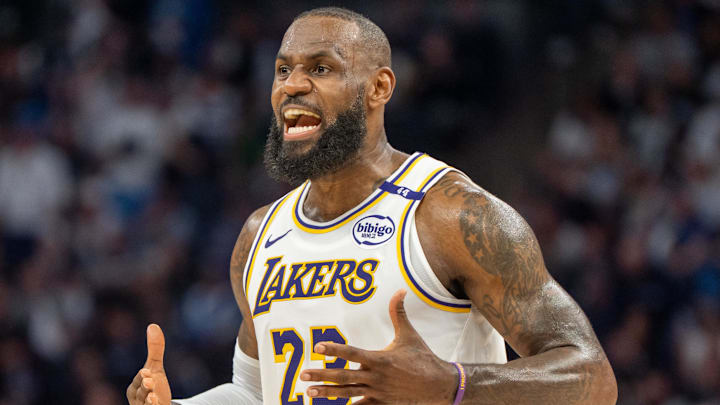 Apr 27, 2025; Minneapolis, Minnesota, USA; Los Angeles Lakers forward LeBron James (23) talks with his coach during a stoppage in play against the Minnesota Timberwolves in the second quarter during game four of first round for the 2025 NBA Playoffs at Target Center. Mandatory Credit: Matt Blewett-Imagn Images Apr 27, 2025; Minneapolis, Minnesota, USA; Los Angeles Lakers forward LeBron James (23) talks with his coach during a stoppage in play against the Minnesota Timberwolves in the second quarter during game four of first round for the 2025 NBA Playoffs at Target Center. Mandatory Credit: Matt Blewett-Imagn Images