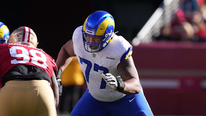 Jan 7, 2024; Santa Clara, California, USA; Los Angeles Rams offensive tackle Alaric Jackson (77) blocks San Francisco 49ers defensive tackle Javon Hargrave (98) during the first quarter at Levi's Stadium. Mandatory Credit: Darren Yamashita-Imagn Images
