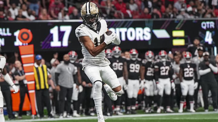 Sep 29, 2024; Atlanta, Georgia, USA; New Orleans Saints wide receiver Chris Olave (12) catches a pass against the Atlanta Falcons during the fourth quarter at Mercedes-Benz Stadium. Mandatory Credit: Dale Zanine-Imagn Images