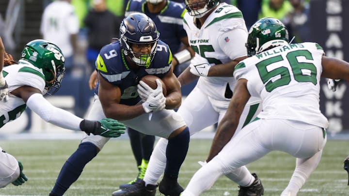 Jan 1, 2023; Seattle, Washington, USA; Seattle Seahawks running back Kenneth Walker III (9) rushes against the New York Jets during the third quarter at Lumen Field. Mandatory Credit: Joe Nicholson-Imagn Images