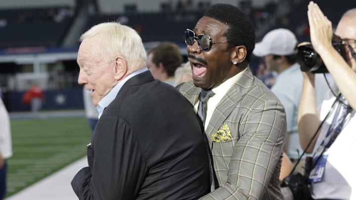 Former Dallas Cowboys Michael Irvin interacts with owner Jerry Jones before the game against the Tampa Bay Buccaneers.
