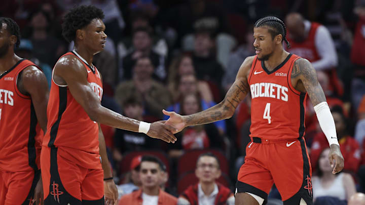 Dec 1, 2024; Houston, Texas, USA; Houston Rockets guard Jalen Green (4) celebrates with forward Amen Thompson (1) after a play during the game against the Oklahoma City Thunder at Toyota Center. Mandatory Credit: Troy Taormina-Imagn Images