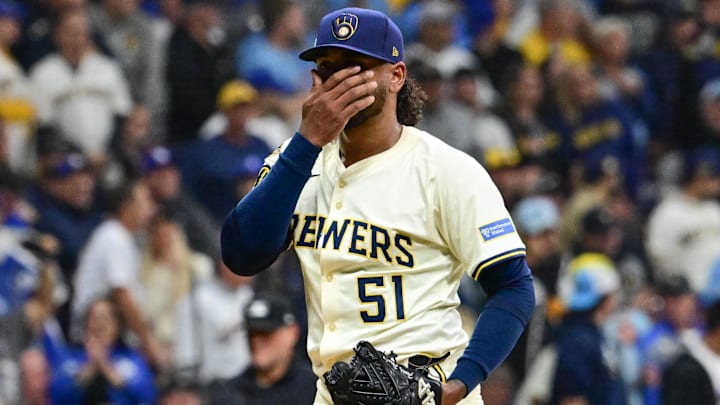 Oct 14, 2025; Milwaukee, Wisconsin, USA; Milwaukee Brewers pitcher Freddy Peralta (51) reacts after giving up a solo home run to Los Angeles Dodgers right fielder Teoscar Hernandez (not pictured) in the second inning during game two of the NLCS round for the 2025 MLB playoffs at American Family Field. Mandatory Credit: Benny Sieu-Imagn Images