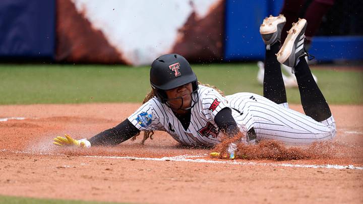 Texas Tech Red Raiders outfielder Mihyia Davis (42) slides home t score a run in the second inning of a Women's College World Series softball game between the Texas Tech Red Raiders and the Mississippi State Bulldogs at Devon Park in Oklahoma City, Thursday, May 28, 2026.