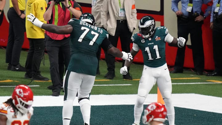 Feb 9, 2025; New Orleans, LA, USA; Philadelphia Eagles wide receiver A.J. Brown (11) reacts with offensive tackle Mekhi Becton (77) after making a touchdown catch against the Kansas City Chiefs during the second quarter in Super Bowl LIX at Caesars Superdome. Mandatory Credit: Kirby Lee-Imagn Images