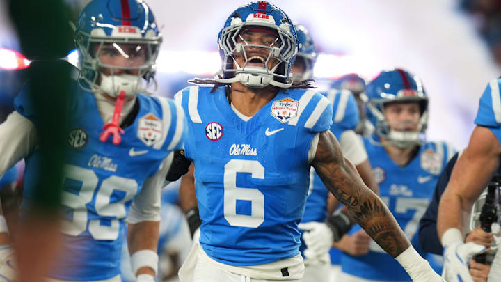 Ole Miss Rebels linebacker TJ Dottery (6) takes the field with his teammates before they play the Miami Hurricanes during their Vrbo Fiesta Bowl matchup at State Farm Stadium in Glendale, on Jan. 8, 2026.