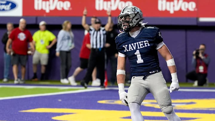Xavier's Carter Hoffmann (1) celebrates after scoring his first touchdown of the game Nov. 20, 2025 during the Class 4A state football championship against the Pella Dutch at the UNI-Dome in Cedar Falls, Iowa.