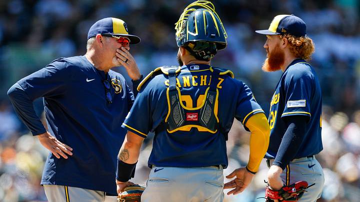Aug 12, 2026; San Diego, California, USA; Milwaukee Brewers pitching coach Chris Hook (84) talks with starting pitcher Dustin May (21) during the fourth inning against the San Diego Padres at Petco Park. Mandatory Credit: David Frerker-Imagn Images Aug 12, 2026; San Diego, California, USA; Milwaukee Brewers pitching coach Chris Hook (84) talks with starting pitcher Dustin May (21) during the fourth inning against the San Diego Padres at Petco Park. Mandatory Credit: David Frerker-Imagn Images