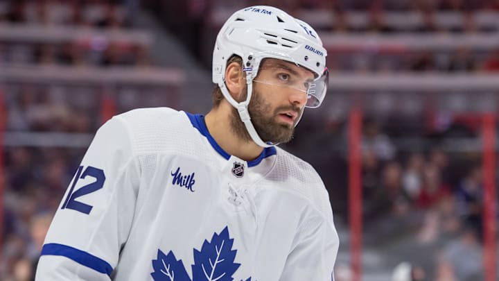 Toronto Maple Leafs center Zach Aston-Reese (12) skates toward the face-off dot.