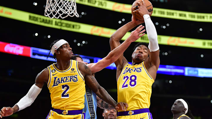 Los Angeles Lakers forward Rui Hachimura (28) gets the rebound in front of forward Jarred Vanderbilt (2) against the Memphis Grizzlies during the second half at Crypto.com Arena.