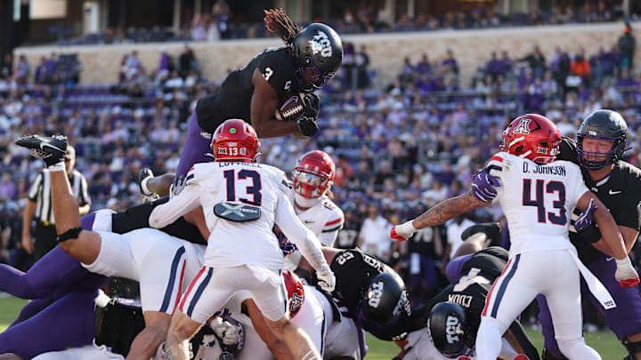 TCU Horned Frogs wide receiver Savion Williams (3) leaps over the pile for a touchdown against the Arizona Wildcats.