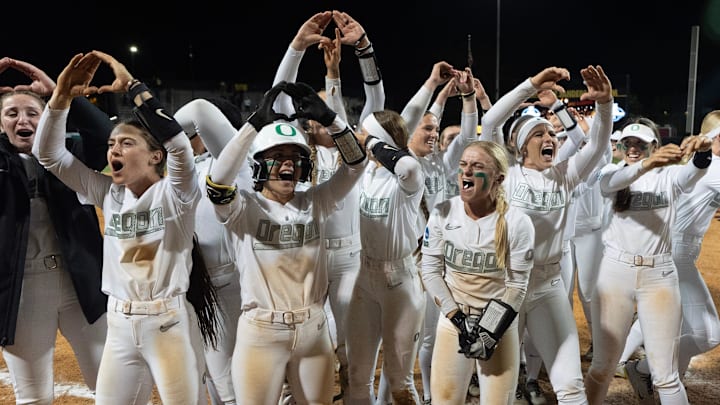 Oregon players celebrate their win against Stanford in NCAA Eugene Softball Regional May 18, 2025.