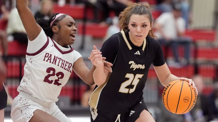 Broken Arrow's Mckenzie Mathurin drives to the basket as Putnam City North's Nate Muriithi defends during the Class 6A girls Oklahoma state basketball championship semifinal tournament game between Putnam City North and Broken Arrow at Yukon High School in Yukon, Okla., Friday, March, 14, 2025. Broken Arrow's Mckenzie Mathurin drives to the basket as Putnam City North's Nate Muriithi defends during the Class 6A girls Oklahoma state basketball championship semifinal tournament game between Putnam City North and Broken Arrow at Yukon High School in Yukon, Okla., Friday, March, 14, 2025.